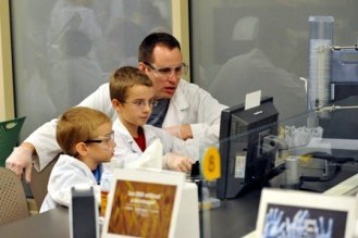 Family working at lab computer